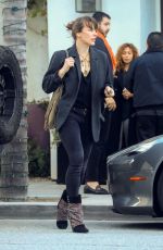MILLA JOVOVICH Leaves Spago in Beverly Hills 03/07/2019