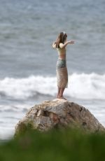 SUKI WATERHOUSE on the Set of a Photoshoot at Zuma Beach in Malibu 03/24/2019