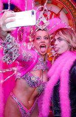 CARA DELEVINGNE and ASHLEY BENSON Poses with Moulin Rouge Dancers in Paris 04/09/2019