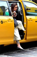 KATIE HOLMES Leaves a Cab in New York 04/18/2019