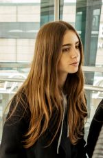 LILY COLLINS at Heathrow Airport in London 04/24/2019