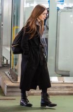 LILY COLLINS at Heathrow Airport in London 04/24/2019