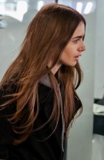 LILY COLLINS at Heathrow Airport in London 04/24/2019