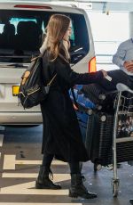 LILY COLLINS at Heathrow Airport in London 04/24/2019