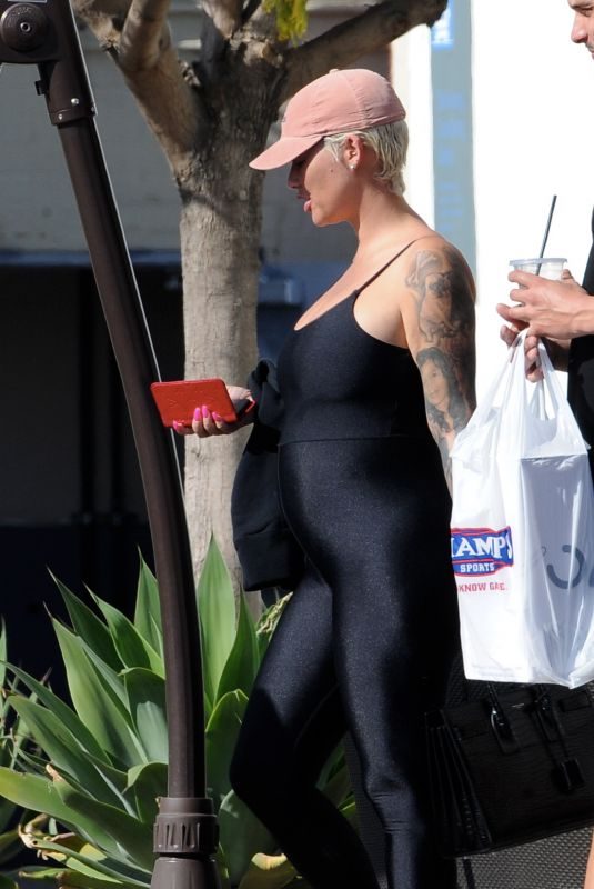 Pregnant AMBER ROSE in Tights at Cheesecake Factory in Los Angeles 04/24/2019