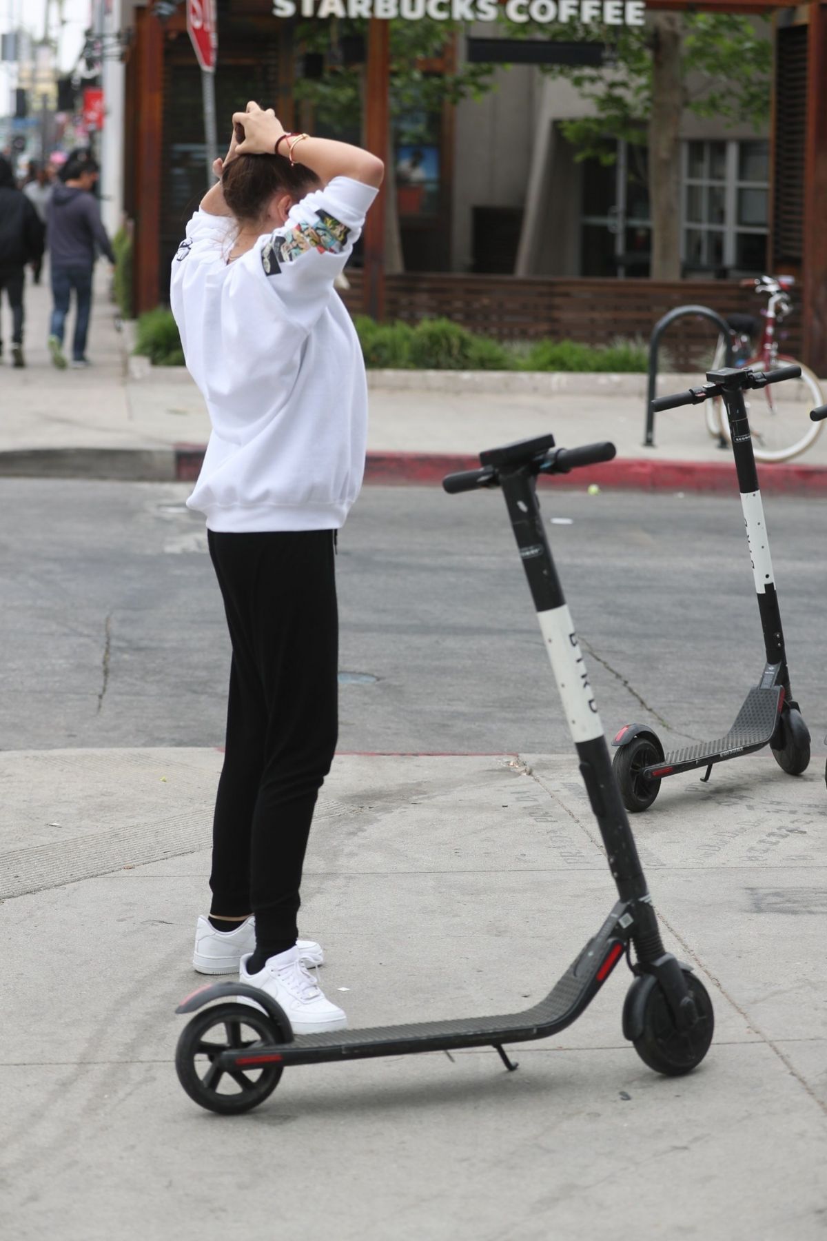 thylane-blondeau-and-samuel-bensoussan-riding-bird-scooters-in-west-hollywood-04-27-2019-1.jpg