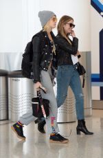 CARA DELEVINGNE and ASHLEY BENSON at JFK Airport in New York 05/08/2019