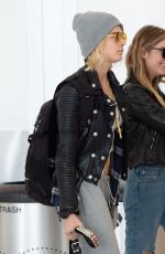 CARA DELEVINGNE and ASHLEY BENSON at JFK Airport in New York 05/08/2019