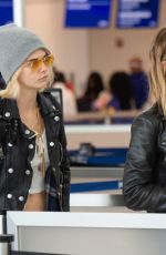 CARA DELEVINGNE and ASHLEY BENSON at JFK Airport in New York 05/08/2019
