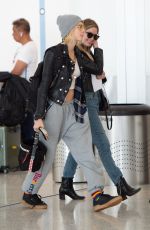 CARA DELEVINGNE and ASHLEY BENSON at JFK Airport in New York 05/08/2019
