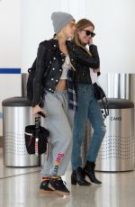 CARA DELEVINGNE and ASHLEY BENSON at JFK Airport in New York 05/08/2019