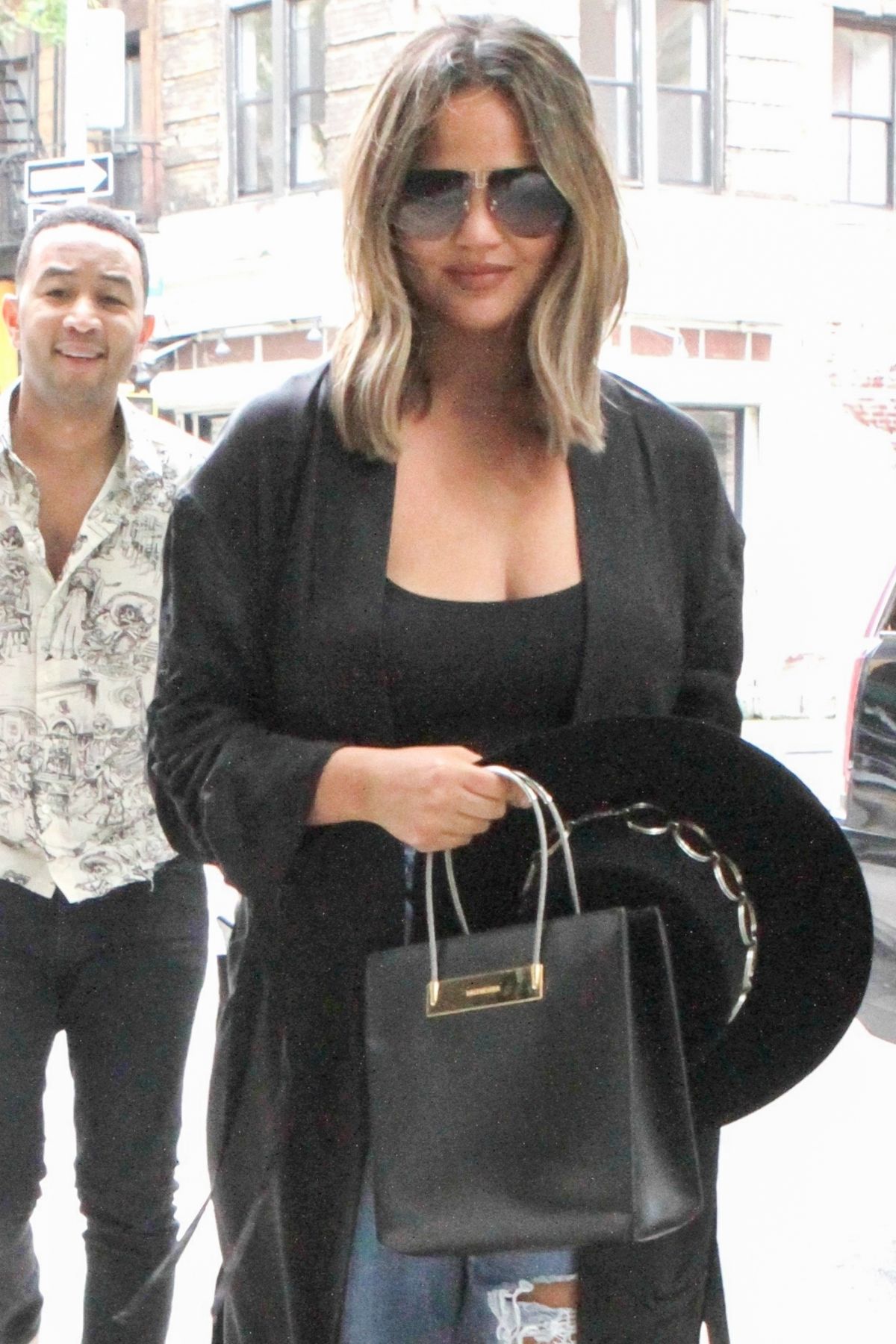 chrissy-teigen-in-ripped-jeans-out-and-about-in-new-york-05-29-2019-2.jpg