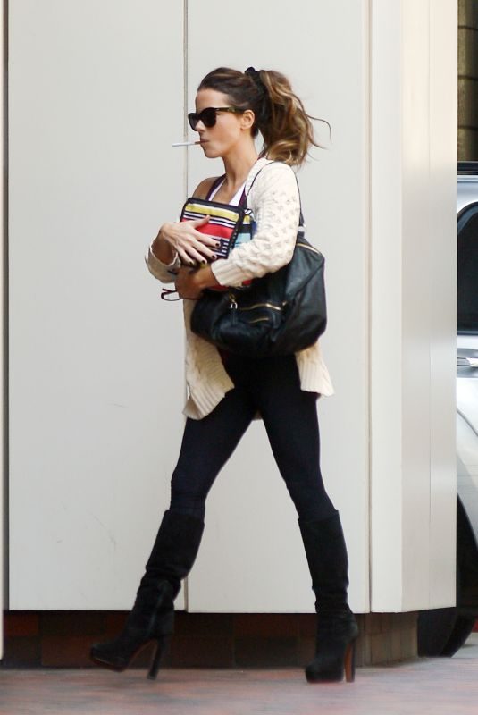 KATE BECKINSALE Smoking E-cigarette Out in Los Angeles 05/21/2019