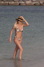 LAURA ANDERSON in Bikinis on the Beach in Dubai 05/12/2019