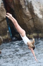 MARGOT ROBBIE in Swimsuit at Hotel Du Cap-eden-roc in Cannes 05/22/2019