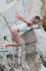 MARGOT ROBBIE in Swimsuit at Hotel Du Cap-eden-roc in Cannes 05/22/2019
