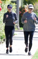 REESE WITHERSPOON Out Jogging with a Friend in Brentwood 05/27/2019