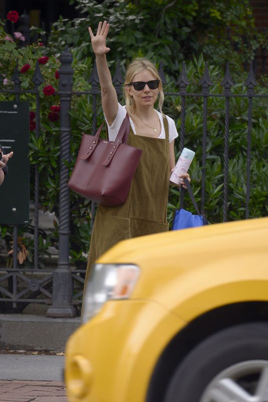 SIENNA MILLER Hailing a Taxi Out in New York 05/29/2019