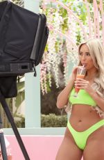 AMBER TURNER in Bikini at a Photoshoot in Ibiza 05/29/2019