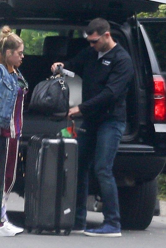 CARA DELEVINGNE and ASHLEY BENSON Arrives at Their Home in Los Angeles 06/04/2019