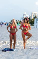 CLAUDIA ROMANI nad DAISY JAE in Bikinis Doing Yoga in South Beach 06/23/2019