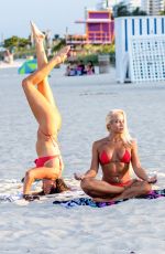 CLAUDIA ROMANI nad DAISY JAE in Bikinis Doing Yoga in South Beach 06/23/2019