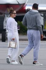 JENNIFER LOPEZ Kissing Alex Rodriguez at a Airport in Miami 06/01/2019
