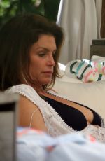 KAIA GERBER and CINDY CRAWFORD in Bikinis at a Pool in Miami 06/22/2019