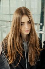 LILY COLLINS at Heathrow Airport in London 04/24/2019