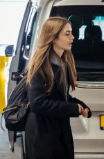 LILY COLLINS at Heathrow Airport in London 04/24/2019