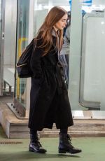 LILY COLLINS at Heathrow Airport in London 04/24/2019