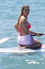 MICHELLE HUNZIKER in Bikini Paddlboarding in Forte Dei Marmi 06/17/2019