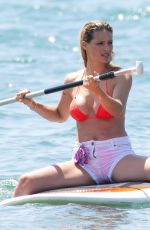 MICHELLE HUNZIKER in Bikini Paddlboarding in Forte Dei Marmi 06/17/2019