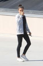 MILA KUNIS Eating Apple Out in Beverly Hills 06/27/2019