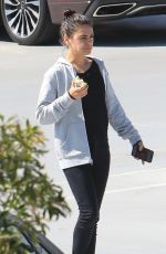 MILA KUNIS Eating Apple Out in Beverly Hills 06/27/2019