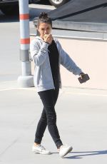 MILA KUNIS Eating Apple Out in Beverly Hills 06/27/2019