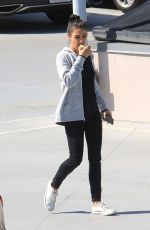 MILA KUNIS Eating Apple Out in Beverly Hills 06/27/2019