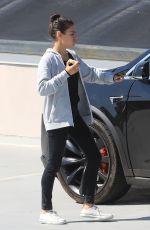 MILA KUNIS Eating Apple Out in Beverly Hills 06/27/2019