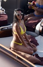 NICOLE SCHERZINGER in Yellow Bikini at a Boat in Capri 06/15/2019