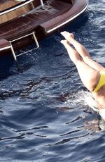 NICOLE SCHERZINGER in Yellow Bikini at a Boat in Capri 06/15/2019
