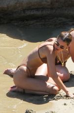 BELLA and GIGI HADID in Bikinis at a Beach on Mykonos Island 07/29/2019
