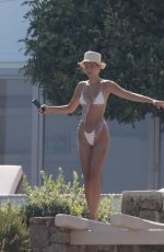 BELLA HADID in Bikini at a Pool on Mykonos Island 07/28/2019