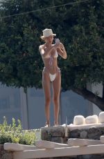 BELLA HADID in Bikini at a Pool on Mykonos Island 07/28/2019