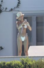 BELLA HADID in Bikini at a Pool on Mykonos Island 07/28/2019