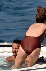 CHRISSY TEIGEN in Swimsuit at a Boat in Portofino 07/02/2019