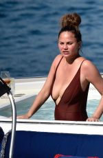 CHRISSY TEIGEN in Swimsuit at a Boat in Portofino 07/02/2019