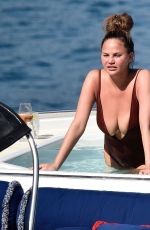 CHRISSY TEIGEN in Swimsuit at a Boat in Portofino 07/02/2019