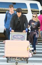 EMMA ROBERTS and Garrett Hedlund at Los Angeles International Airport 07/03/2019