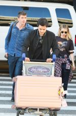 EMMA ROBERTS and Garrett Hedlund at Los Angeles International Airport 07/03/2019