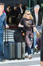 EMMA ROBERTS and Garrett Hedlund at Los Angeles International Airport 07/03/2019